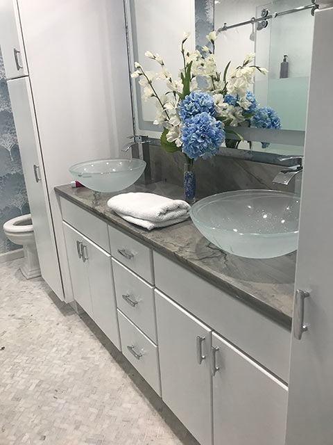 Brava Blue Quartzite bathroom counter with glass vessel sinks.