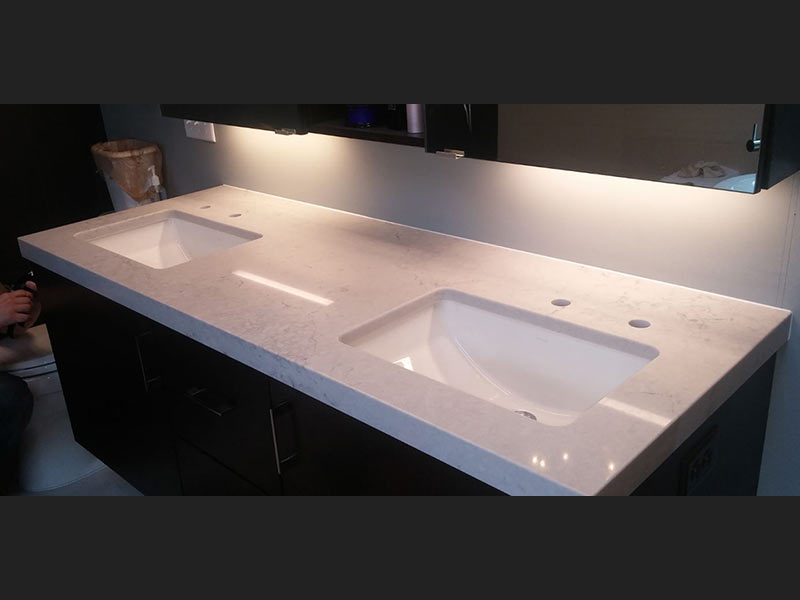 Noble Gray Quartz bathroom counter top with double sinks.