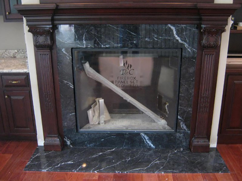 Black Marquina Marble fireplace surround and hearth. 