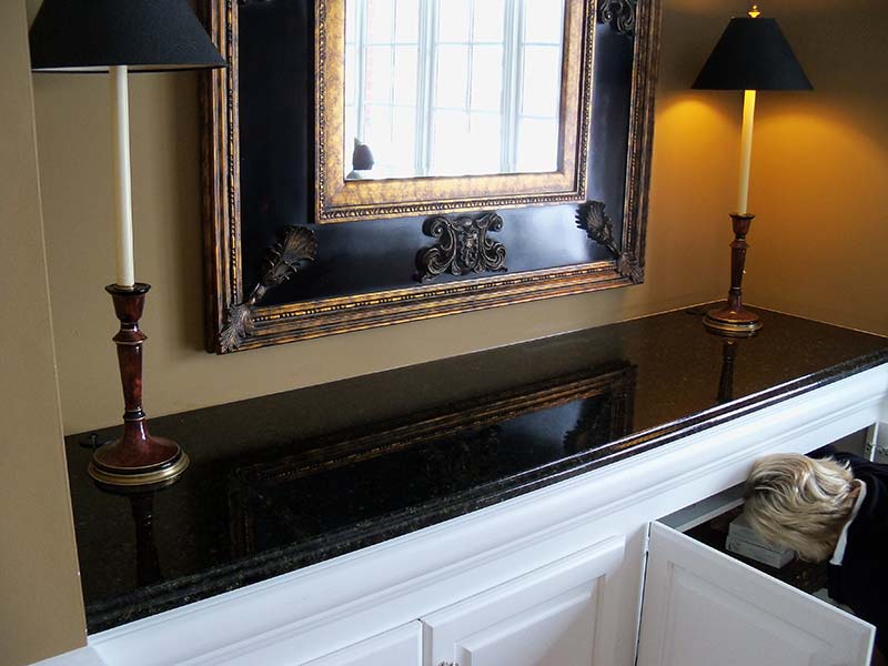 Uba Tuba Granite counter sits atop a white credenza.