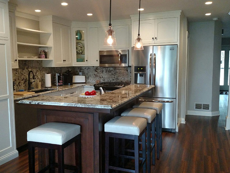 Ice Brown Granite counter and backsplash with darkcabinets 