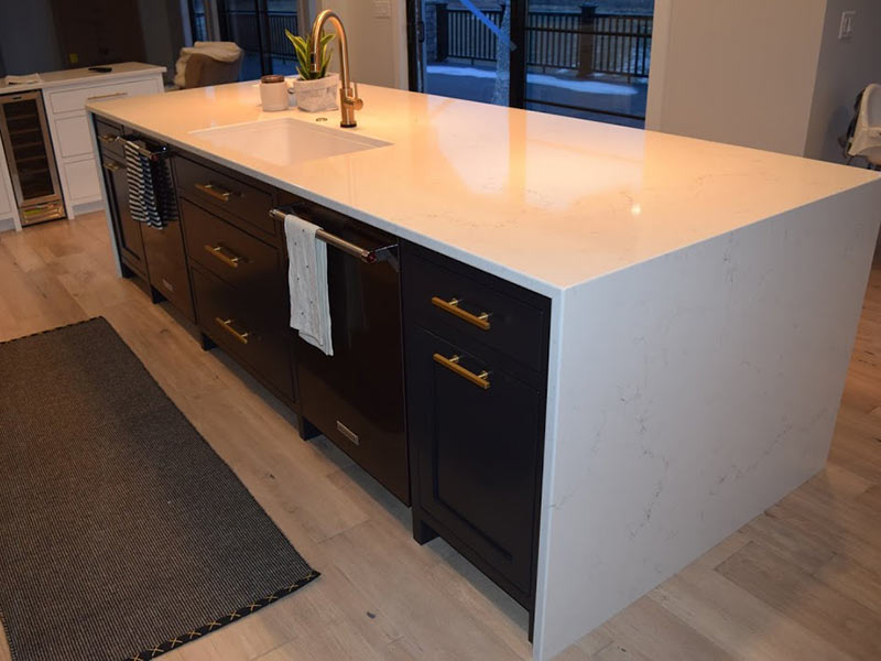 Misterio Vicostone Quartz:  White with Grey Vein with waterfall legs on island