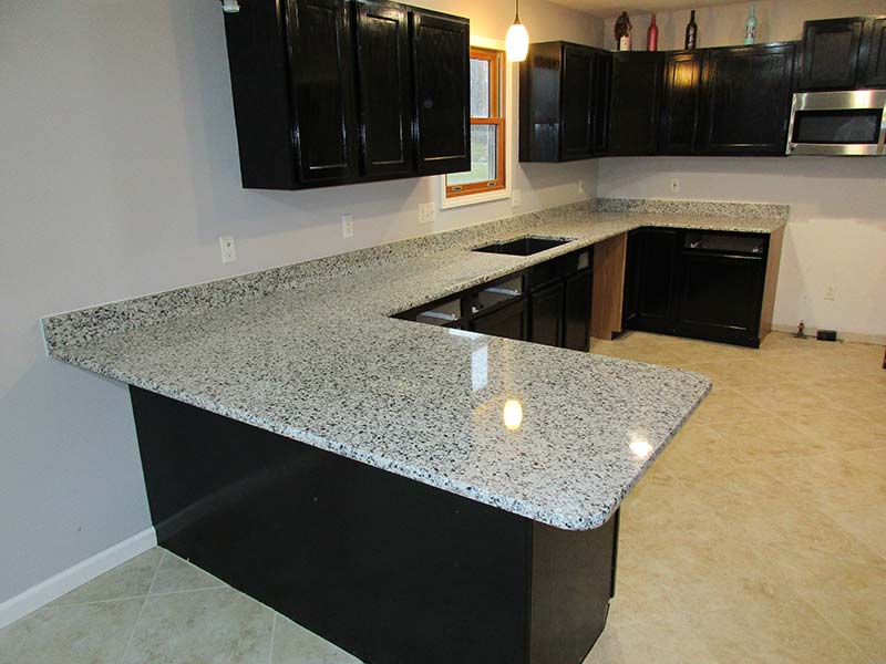 Valle Nevado Granite counters and black cabinets in the kitchen? Yes Please!