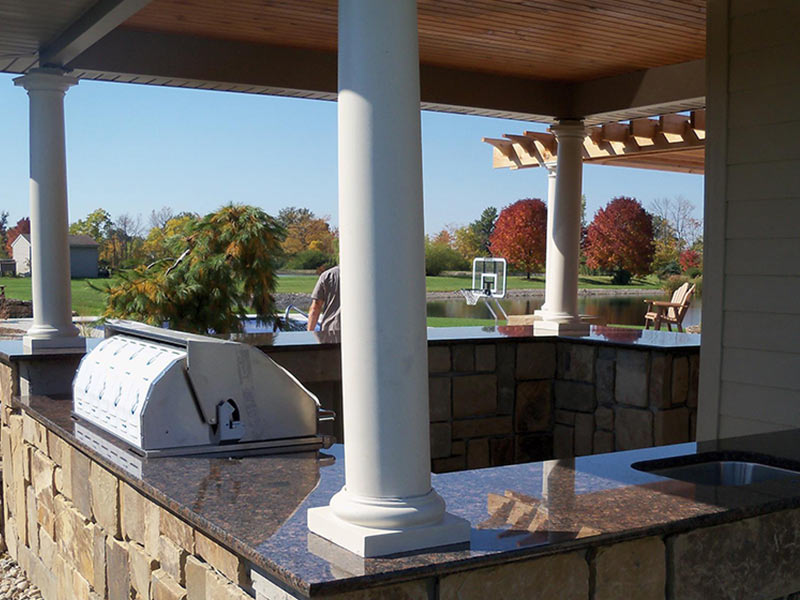 Imperial Coffee Granite sets off this outdoor kitchen.
